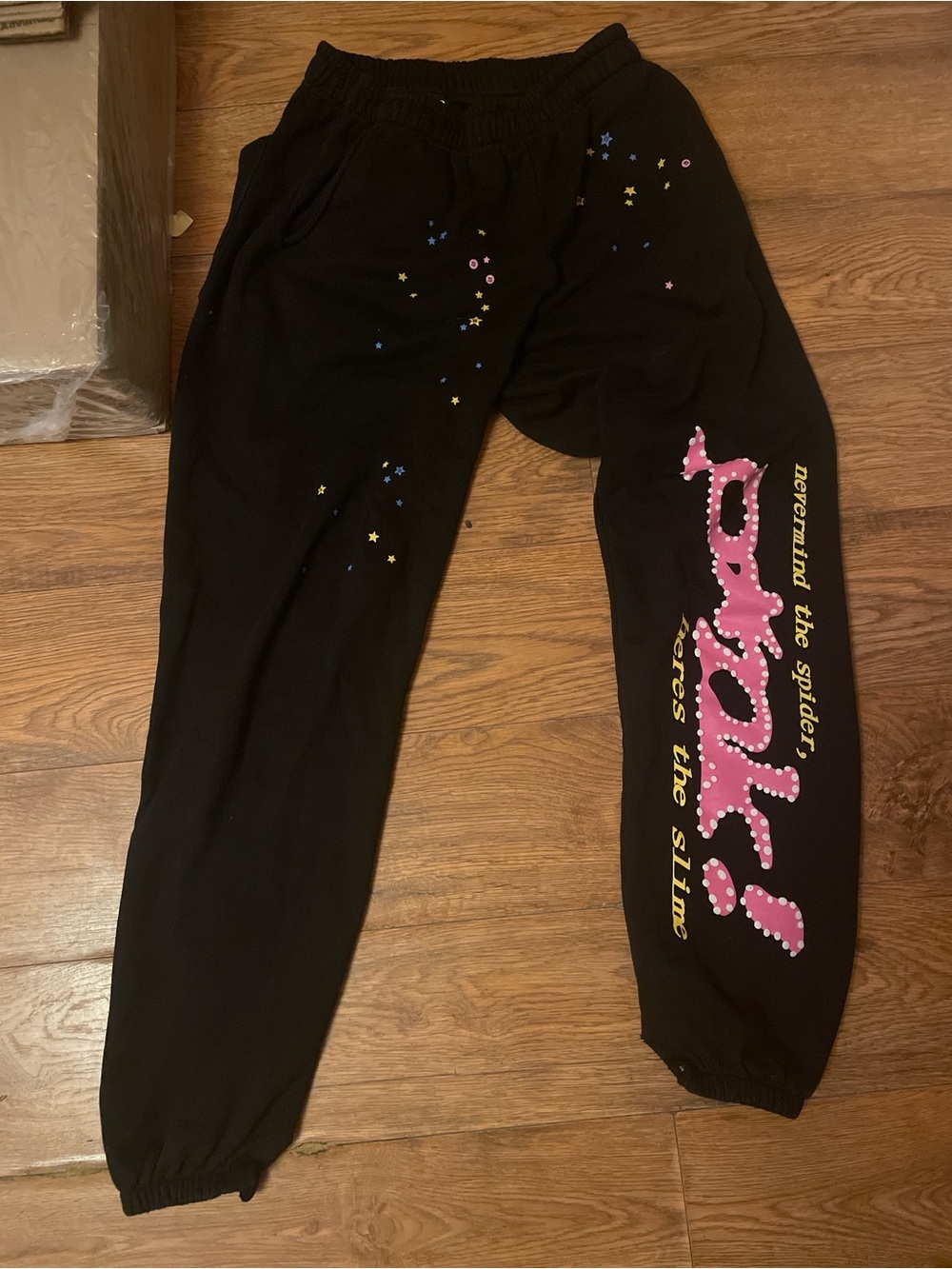 Sp5der pantswith Pink Graphic Script and Star Accents
